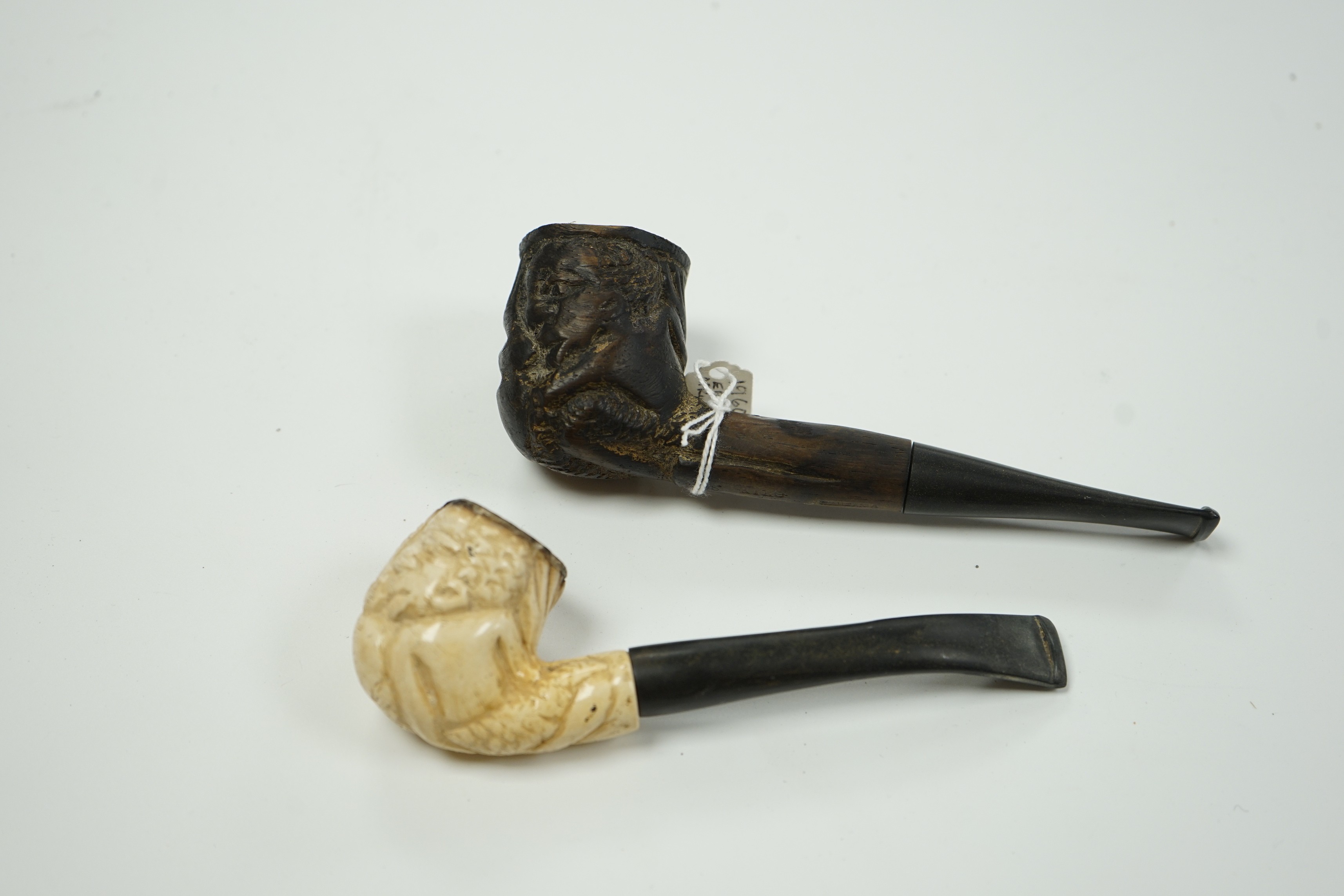A Meerschaum pipe and an African ebony pipe